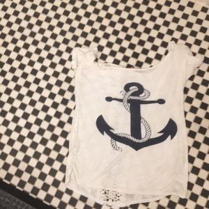 white shirt with navy anchor on the front